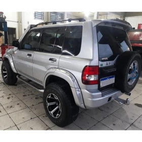Jogo de Alargadores Fender para Mitsubish Pajero TR4 de 1998 até 2009